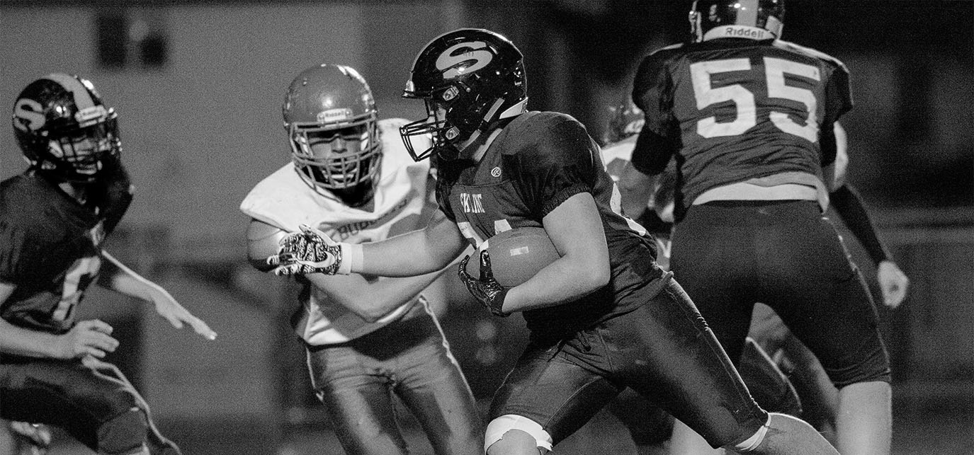 grainy football action image